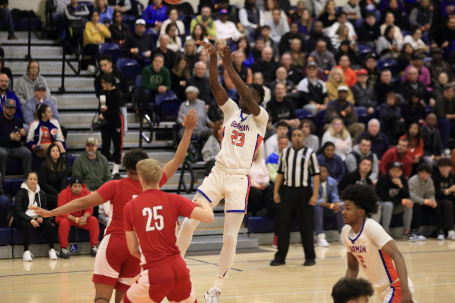 Number 23 Chris Nwuli takes a shot