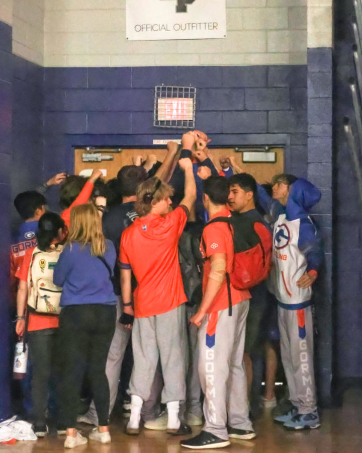 The wrestling team huddles up before a meet