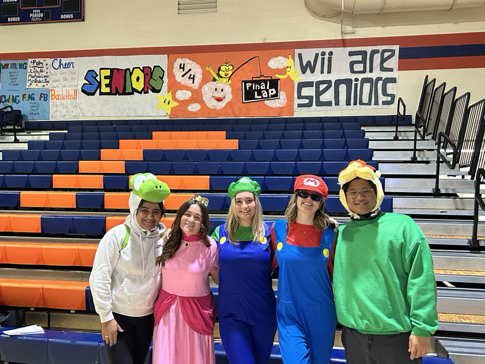 Our Bishop Gorman Assembly leaders, Navya Madhura, Zoe Parker, Sage Barden, Payton Canfield, and Gabe Clemente prepare for the Winter Wiik Assembly. They dress up as Mario Kart characters to get the assembly started.
