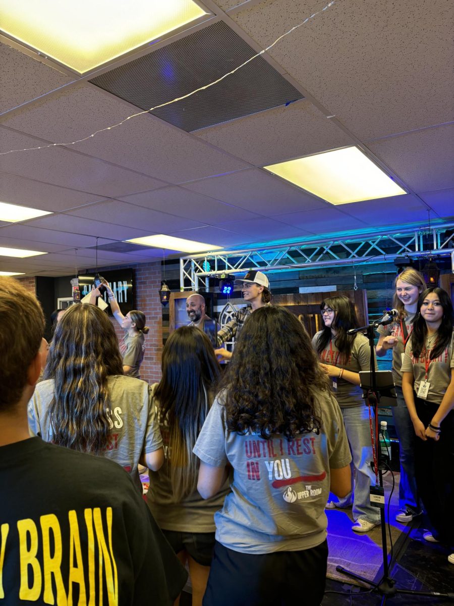 The Core Team singing worship songs together and having fun after a Life Night on 9/15. On the left of the stage is Louie Latina, leader of the youth ministry at Holy Spirit and Bishop Gorman alumni. 