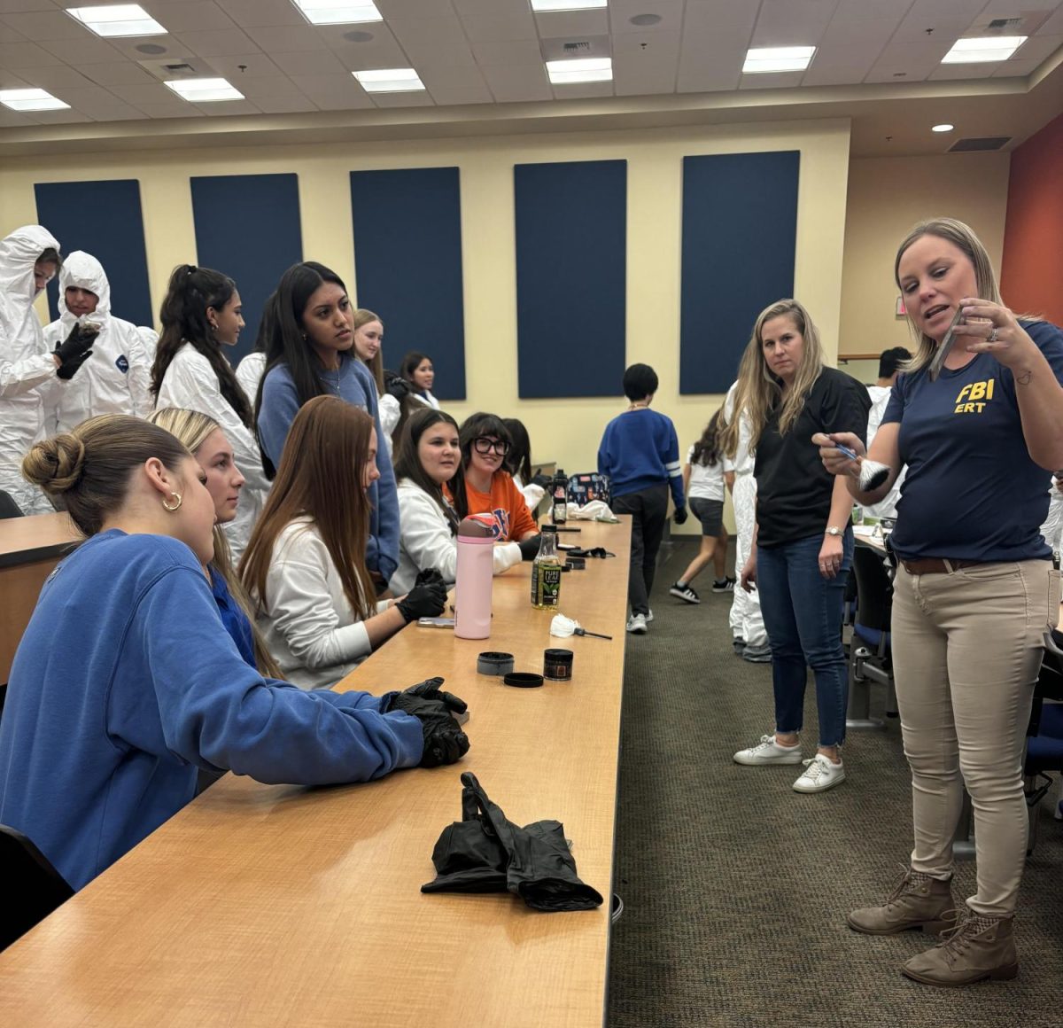 FBI Agents Kimberly Albamonte and Sadie Garcea giving WiSTEM members a hands-on approach to learning about what the FBI entails.