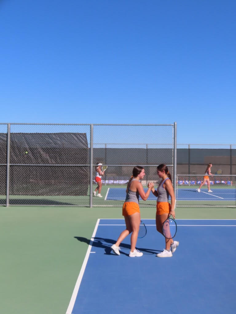 Sophie Berger '25 and Emma Balelo '25 celebrating after winning their match.