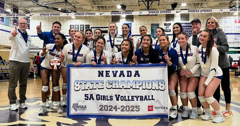 Volleyball with the State Champions banner after winning state! 