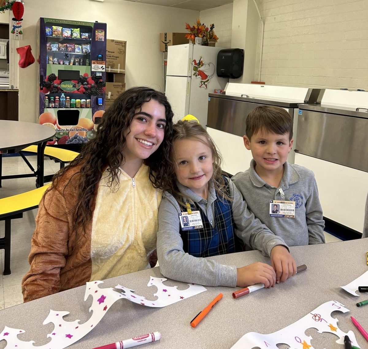 Sophia Lagomarsino '26 with St. Viator students. 