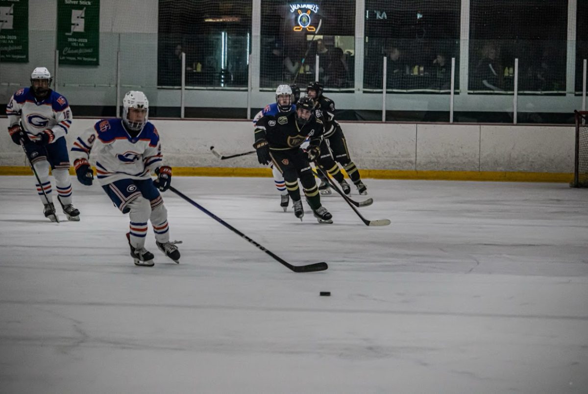 Gorman player taking the puck in the zone to prepare for a breakout.