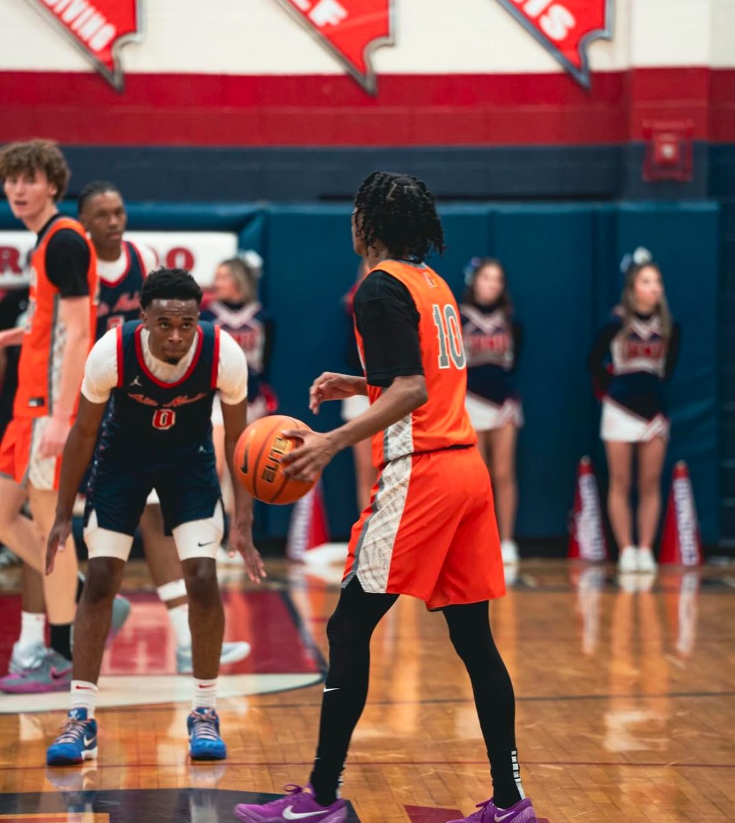 Nick Jefferson (right) bringing the ball up against Johnny Collins (left)