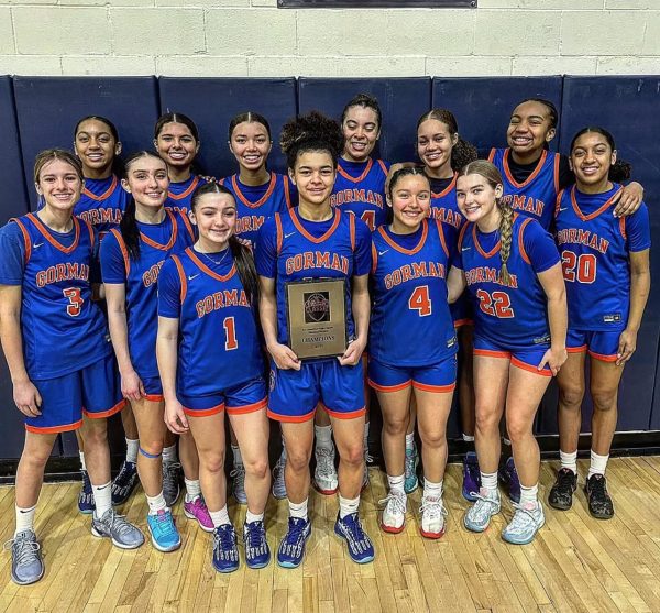 Bishop Gorman Girls Basketball holds up championship trophy on Dec 30, 2024 