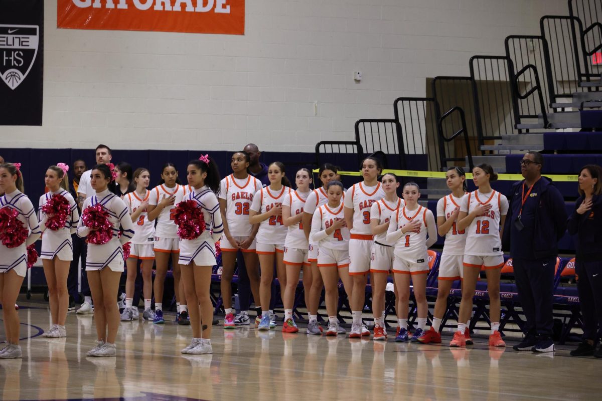 Women's basketball during the Star Spangled Banner before their Feb. 13 playoff game against Liberty High School. 