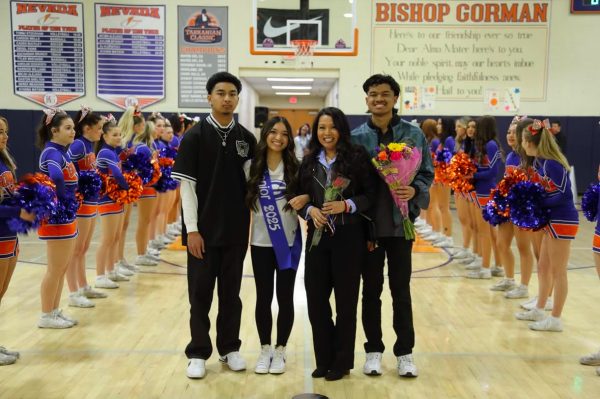 Dance Team Senior Jaila-Ann DelaLlana '25 being walked out by her family on Senior Night.