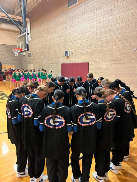 Dance Team praying before they compete for the first time of the season at USA Regionals. 