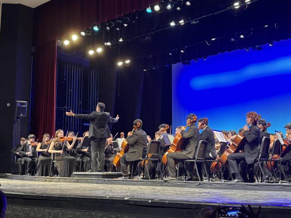 Conductor Farkhad Khudyev leads the All State High School Orchestra. 