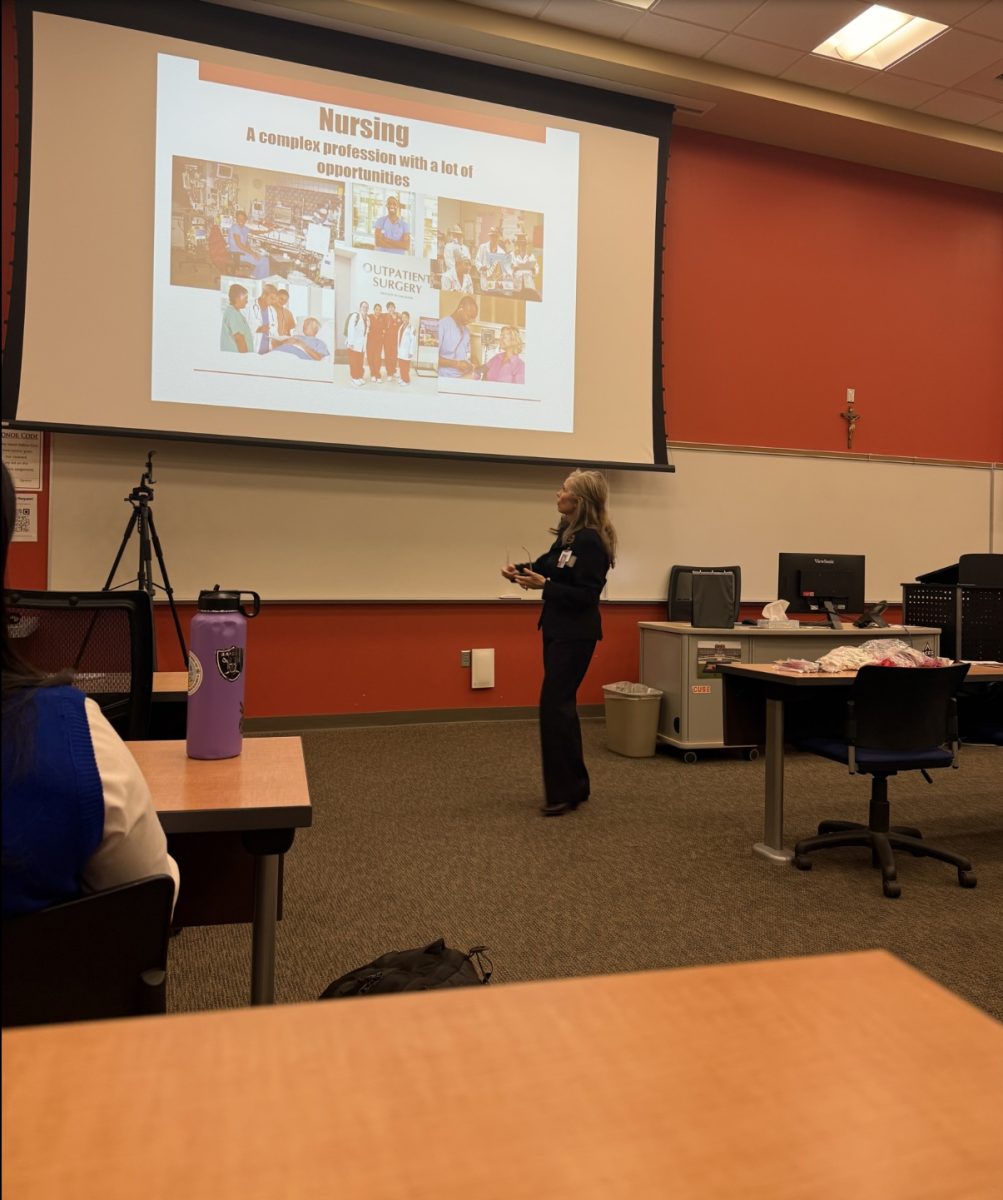 Shona Rue, the Academic Faculty and Clinical Instructor of the UNLV School of Nursing , presenting to the members of Medical Society.