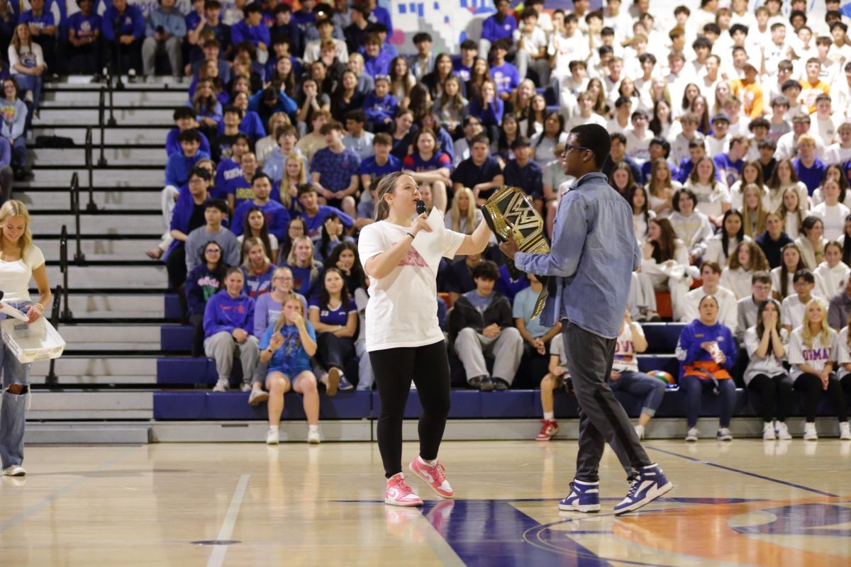 Averie Smith '25 taking the stage at the prom assembly 