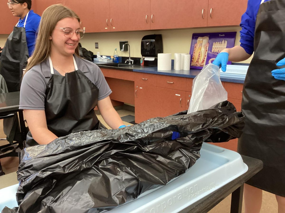 Reagan Millbern '26 and Ellie Patta '26 taking their cat out of the bag. 