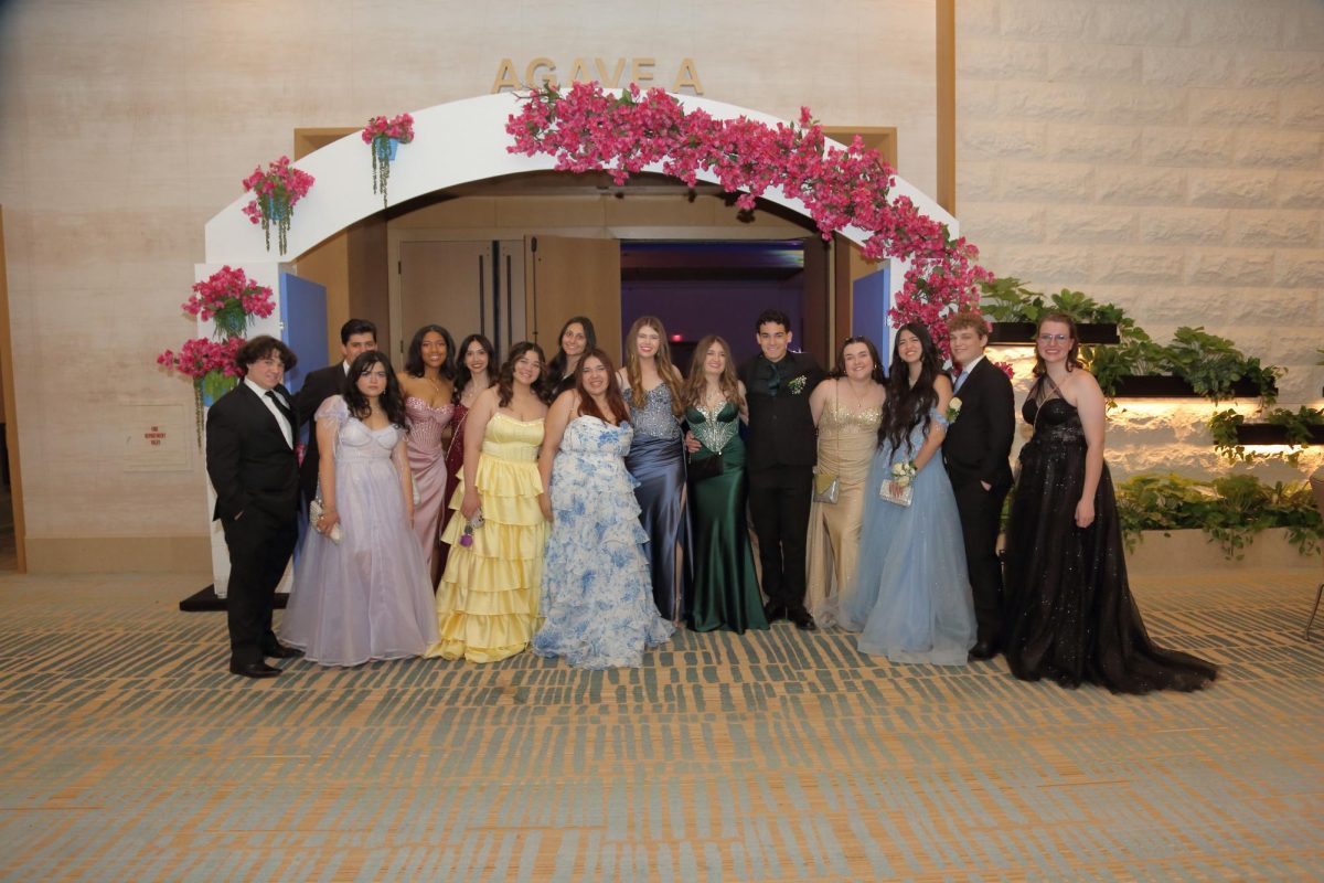 A group of students outside of the prom dance. 
