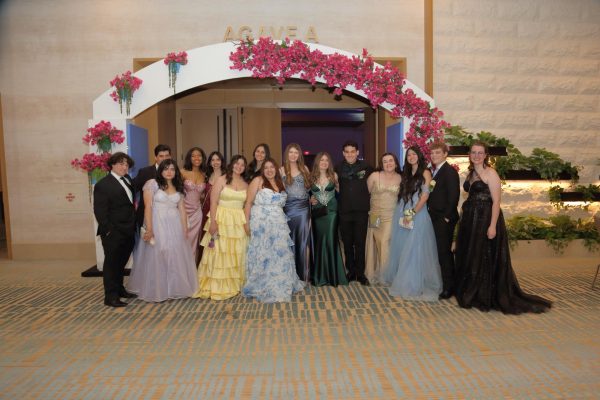 A group of students outside of the prom dance. 