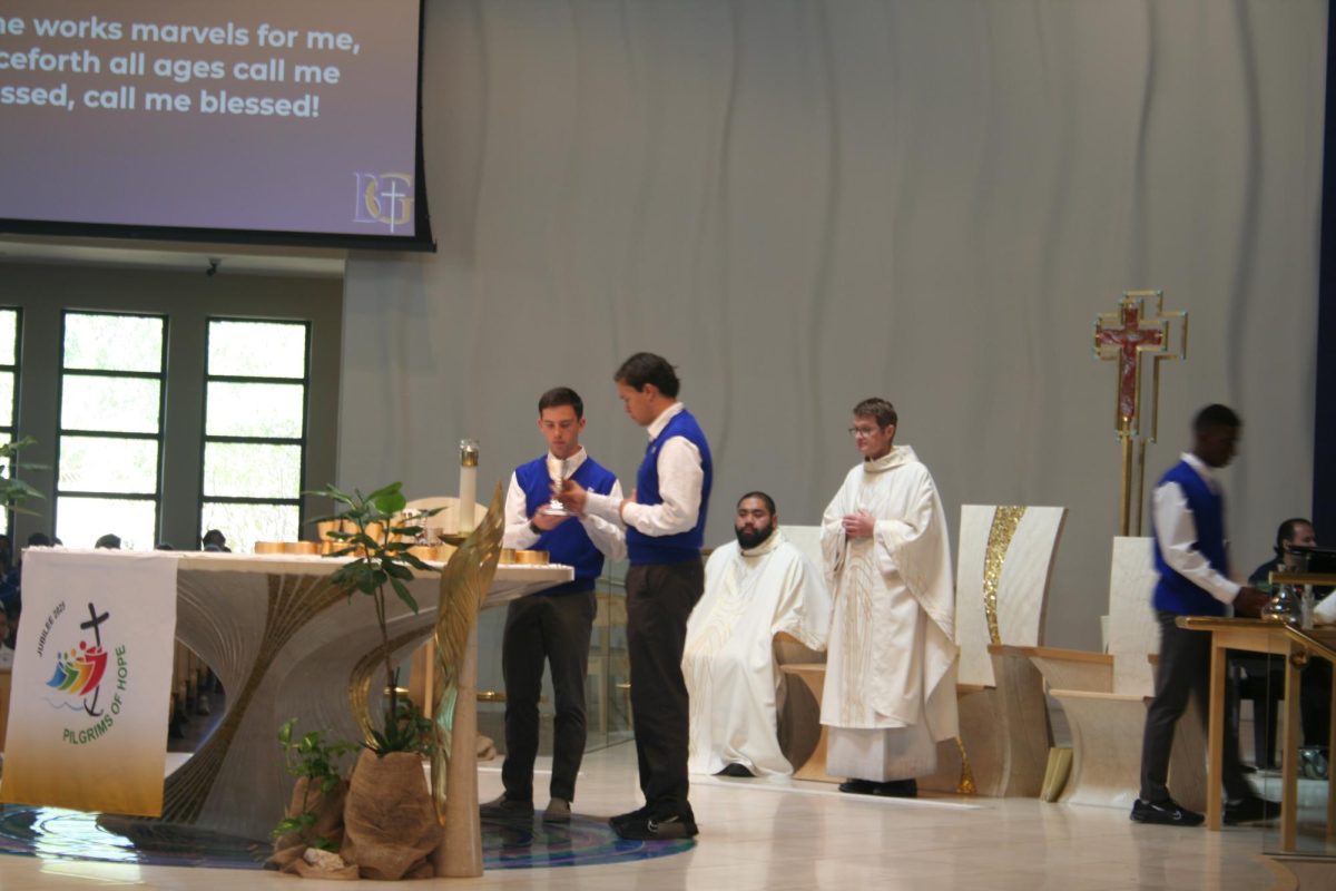 Altar servers preparing for the Eucharist. 