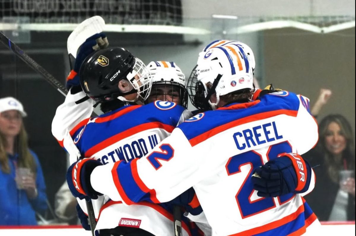 Division 1 varsity celebrating after a goal.