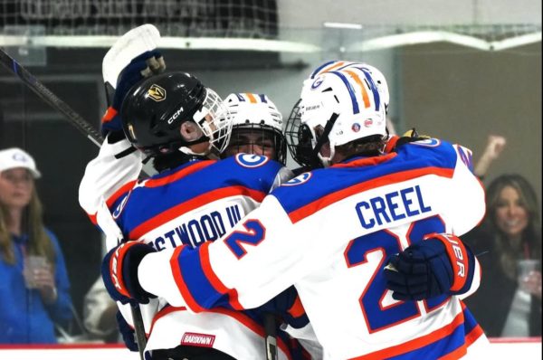 Division 1 varsity celebrating after a goal.