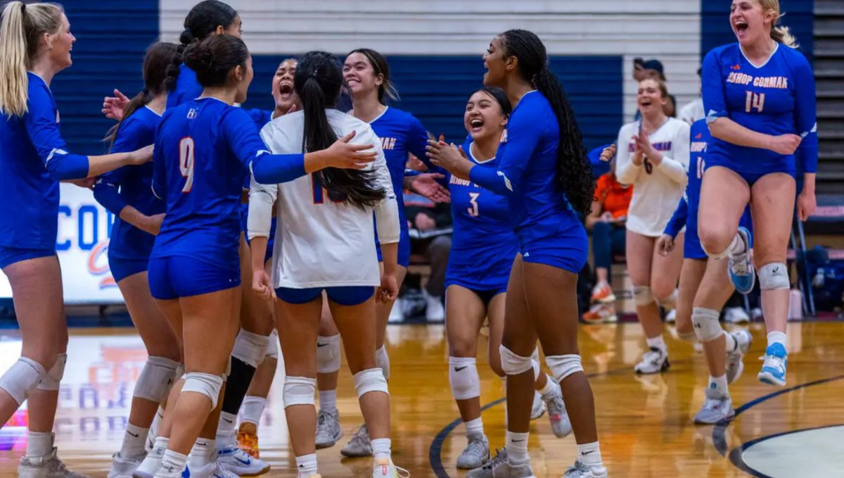 Bishop Gorman girls volleyball celebrating a point.