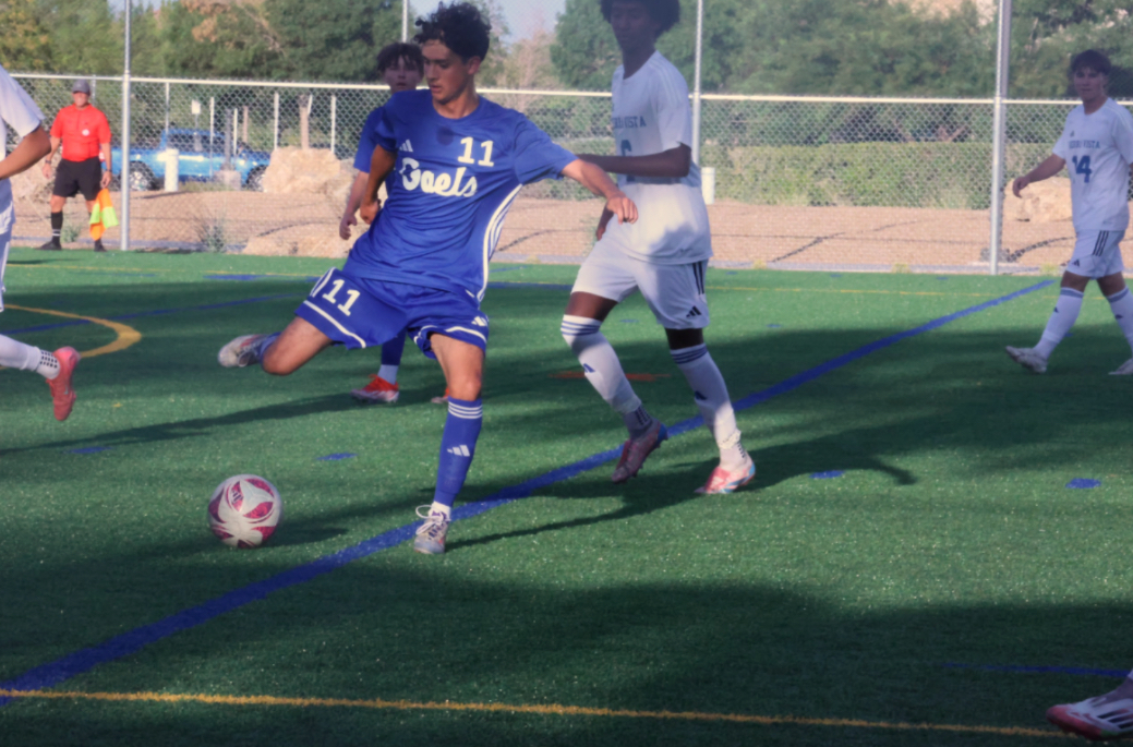 Midfielder Hector Miranda '26 kicking the ball. 