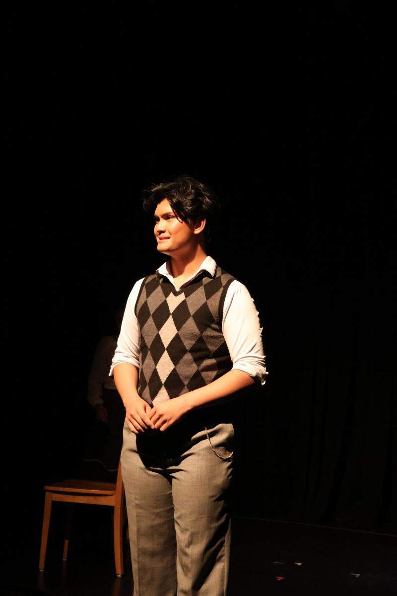 Cooper Macalalad '26 playing as the stage manager in the theater production, Our Town 