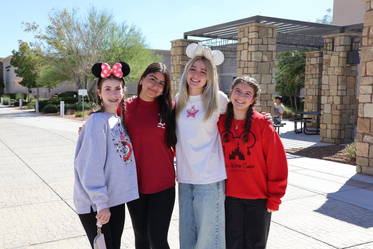 Students dressed as Disney adults outside the commons by the Student Union on Disney adult day. 