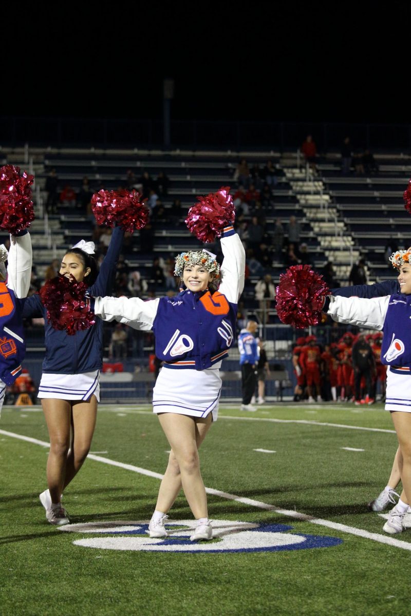Senior Avery Pearson performing on her senior night for cheer.