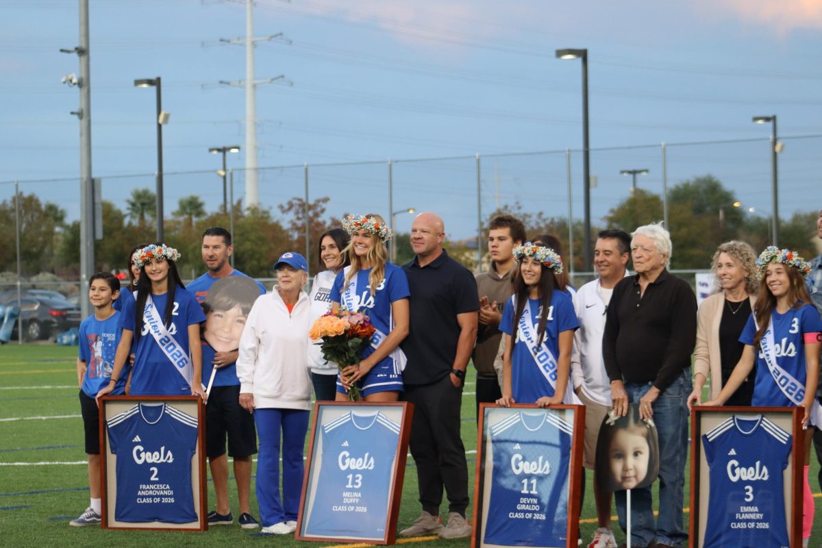 Senior soccer girls gathered together.