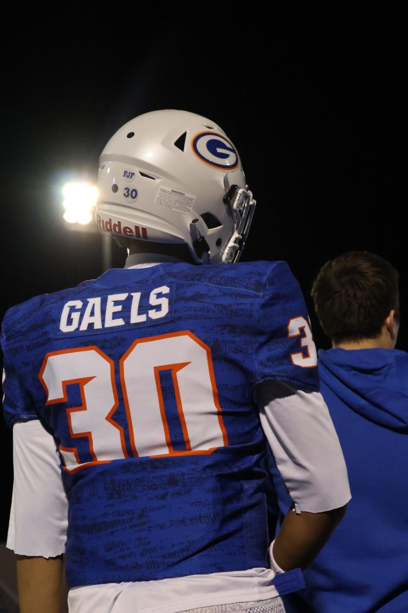 Mason Senzaki '26 on the sideline getting ready for the next play 
