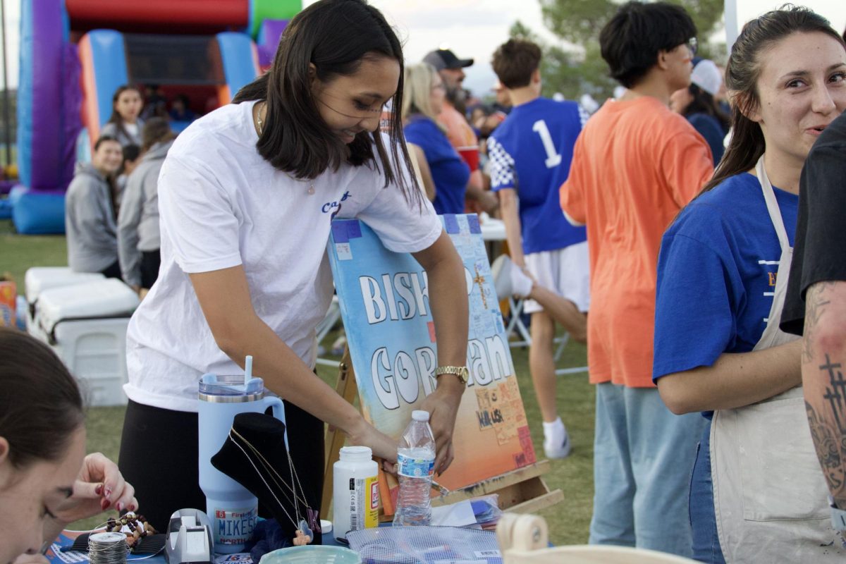 Lillia Robinson-Palomata '26 at the art table at homecoming tailgate 