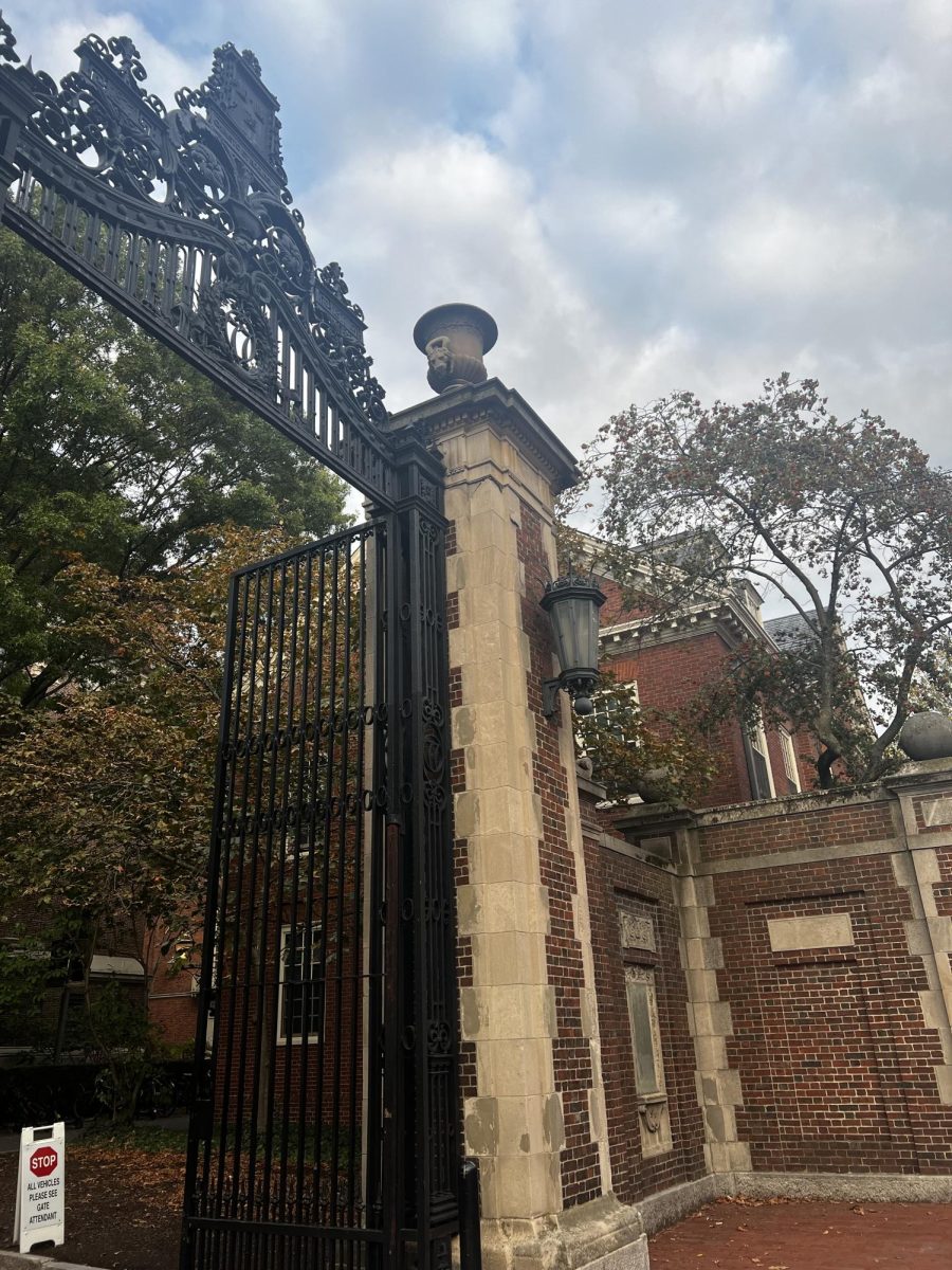 A picture of a gate leading towards the Harvard campus.