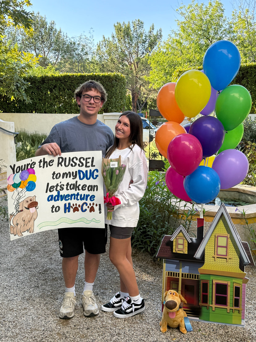 Ryan Cambeiro ‘28  asking Payton Bosari ‘28 to Homecoming with the poster he made.