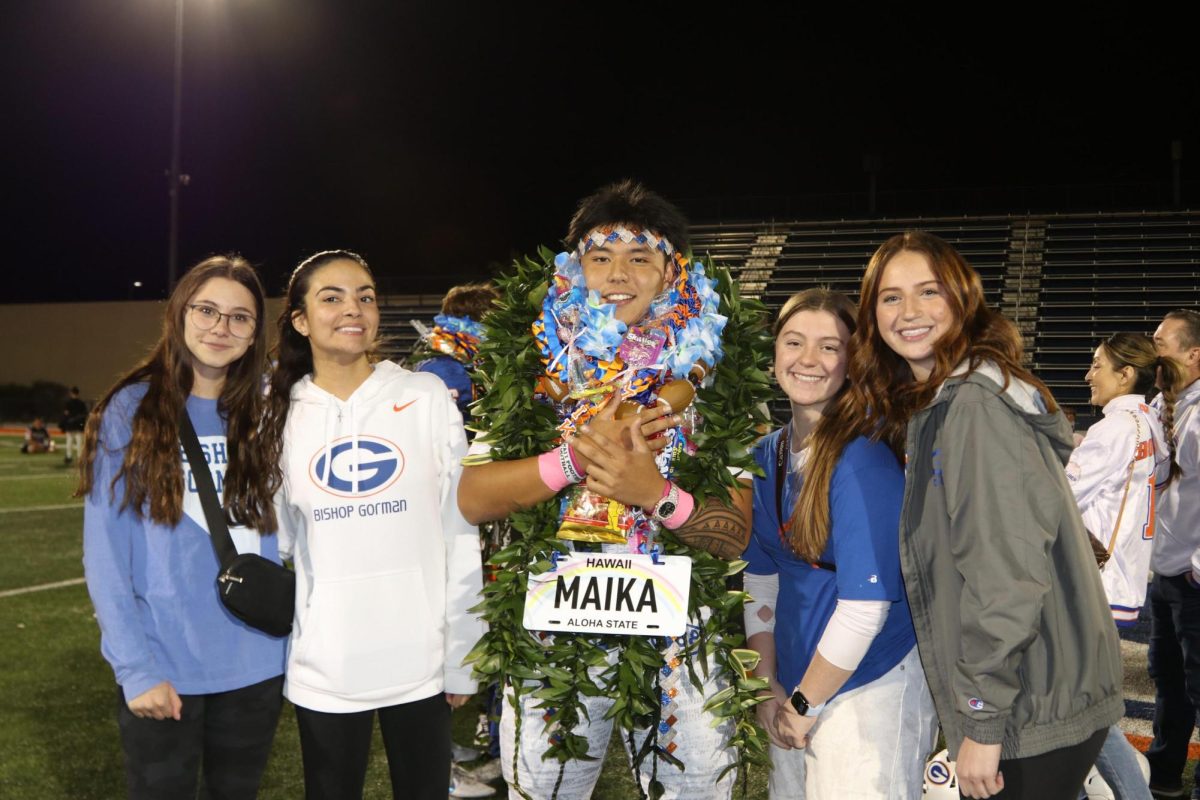 Makenzie Medford '26, Mya Munoz '26, Maika Eugenio '26, Reagan Millbern '26, and Katelyn Domina '26 taking a picture after the football game. 