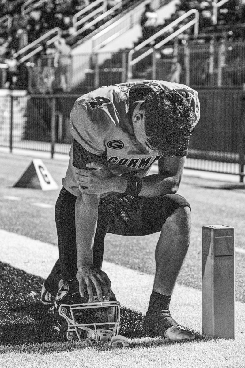 Kaina Watson '26 Praying prior to game 