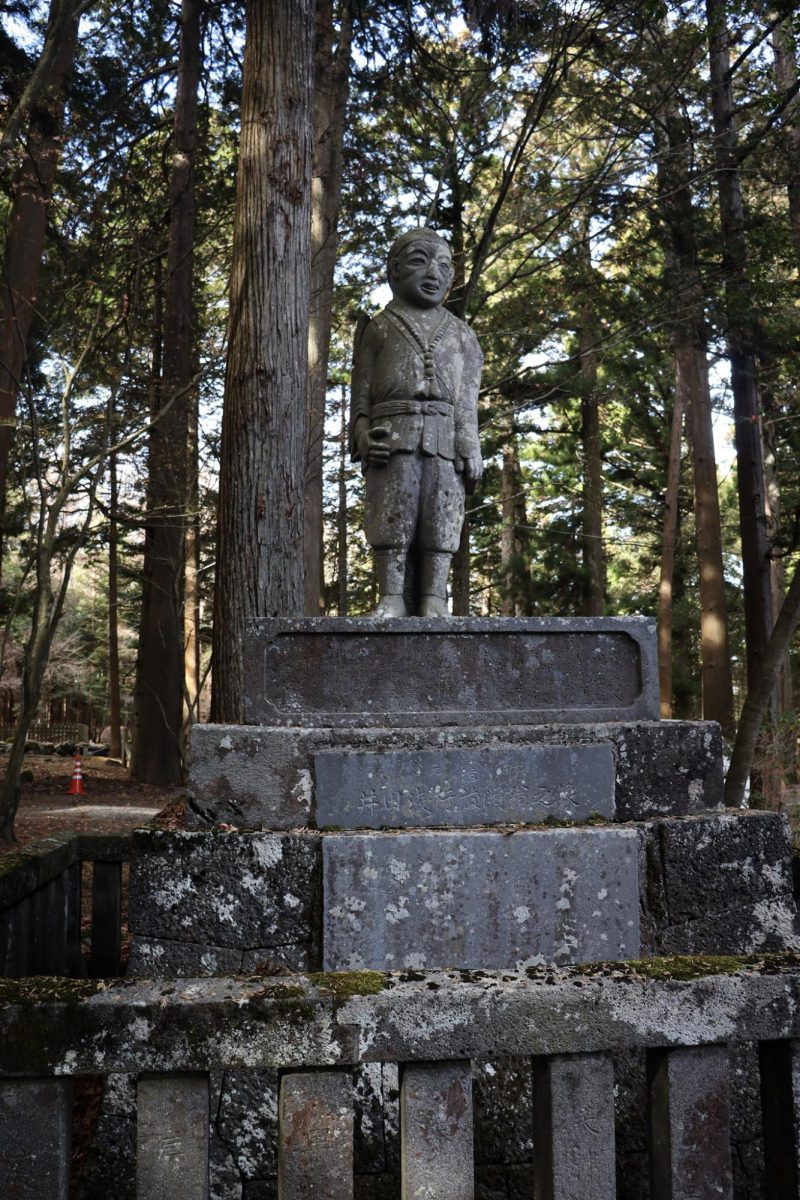 Stone statue of Jizo Bosatsu who offers protection from demons entering grave sites. These are found on top of influential Japanese family's graves.
