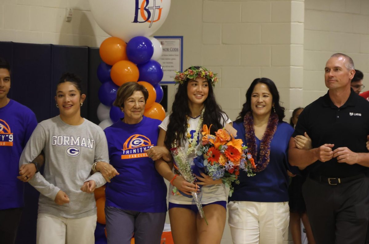 Trinity Thompson 26’ celebrates varsity volleyball senior night with her family by her side.