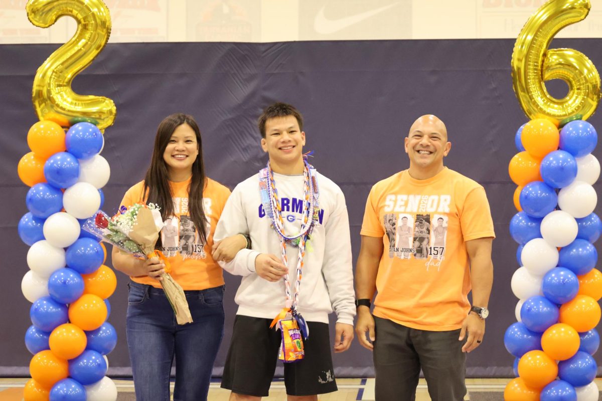 Senior Tristan Johns celebrating his senior night with his family.