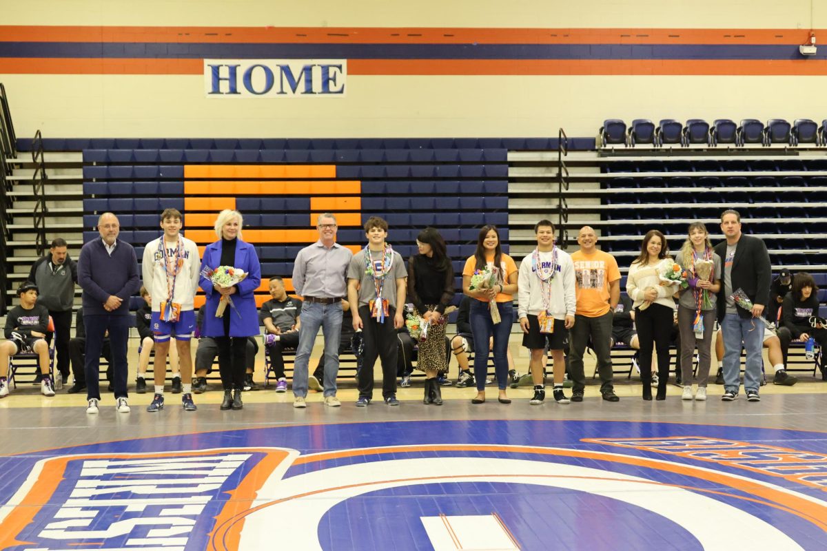 Senior wrestlers alongside their family.