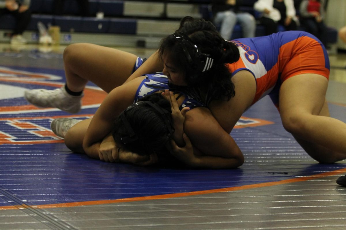 Maia Marrero '27 throwing her opponent into a half nelson.