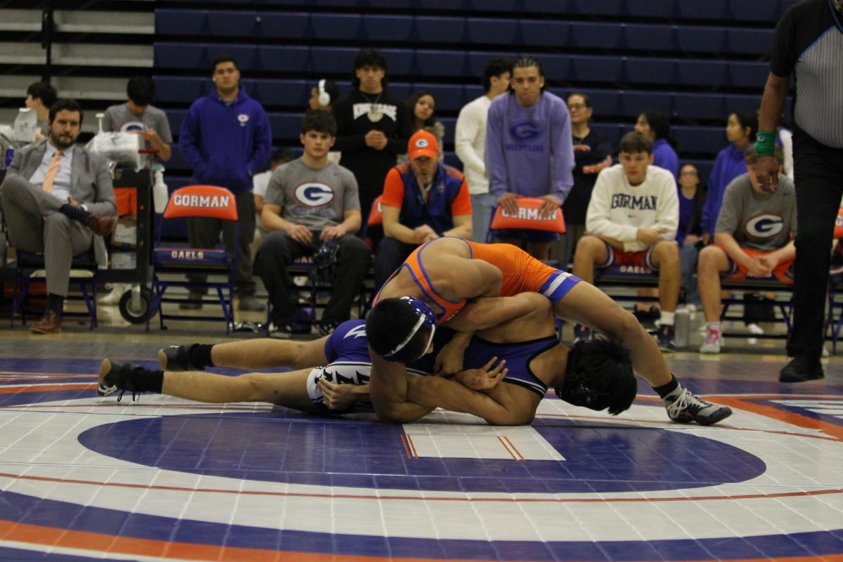 Connor Johns '28 about to pin his opponent.