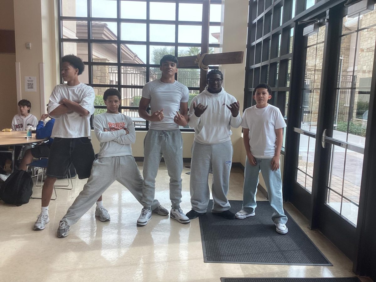 Group of students strutting their white clothes for WhiteOut Wednesday.