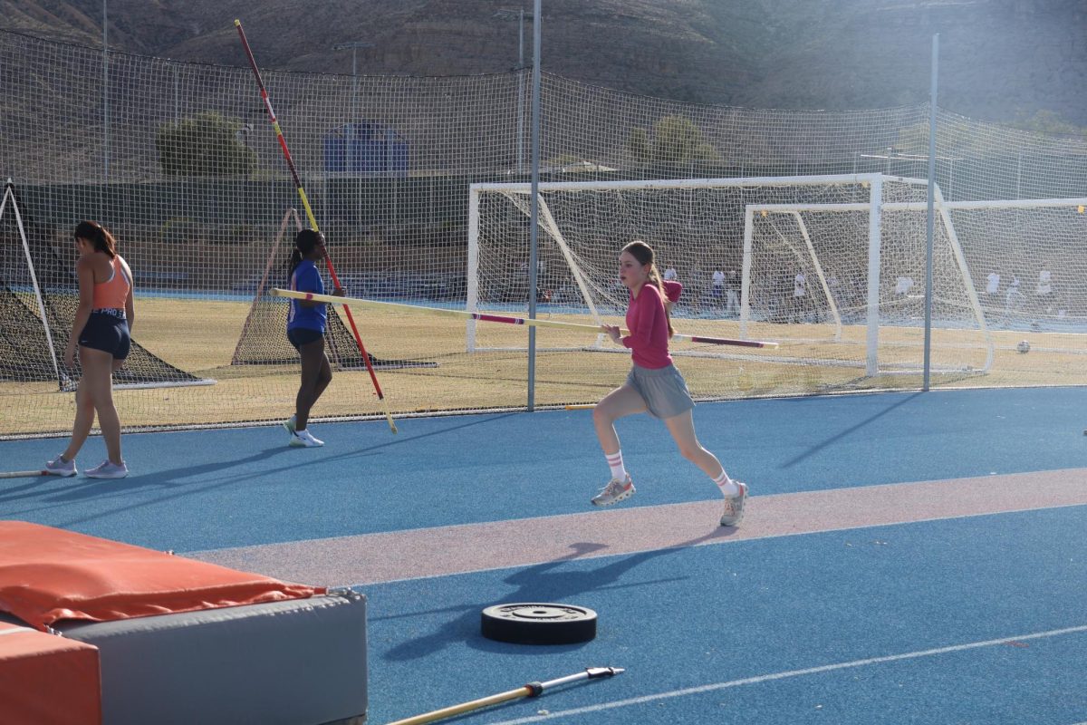 Pole vaulter Avery Rulis '26 getting her running start before her jump.