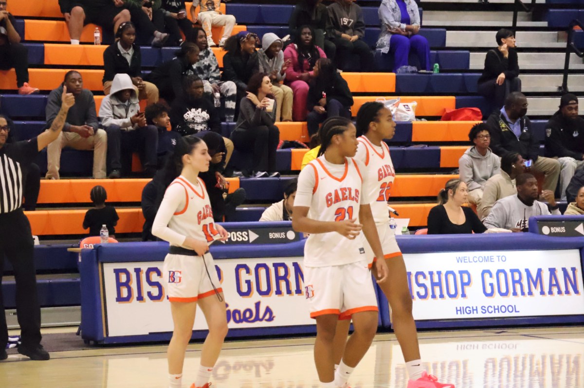 Kenzee Holton '27, Arianna Brewer '29, and Aubrey Johnson '28 taking the floor for Gorman