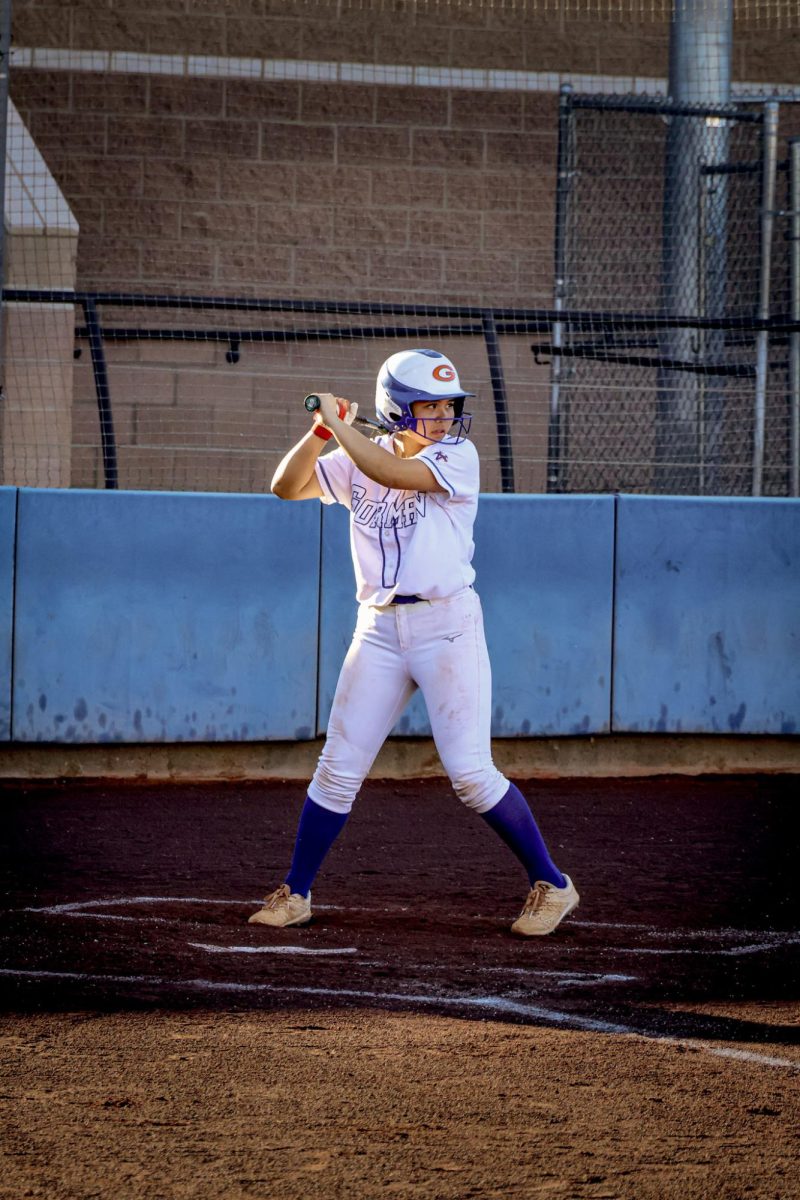 Short Stop Celine Paragan '28 heading into a 3-2 count approach 