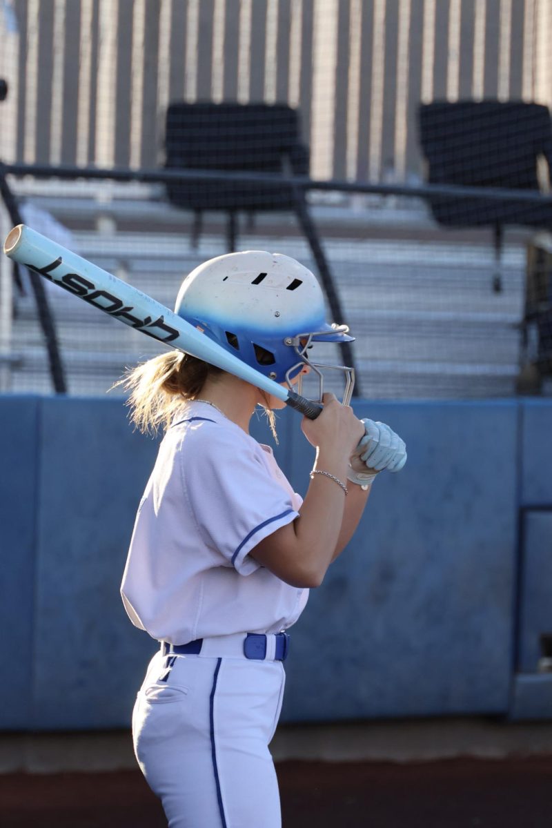 Outfielder Ella Brown '29 preparing in the on deck circle to have a successful at bat. 