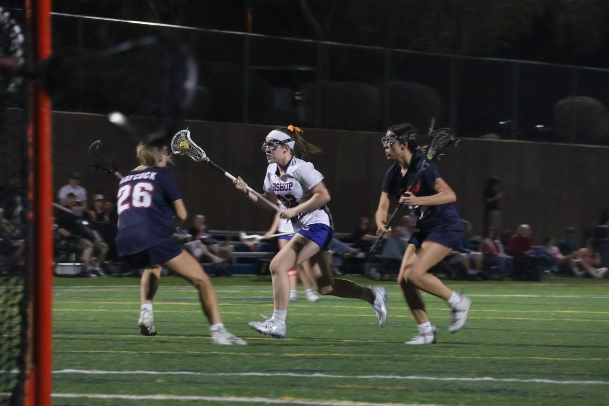Casey Bone '29 charges toward the goal with the ball.