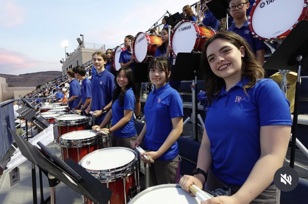 BGHS drumline preparing to perform at Fertitta Field.